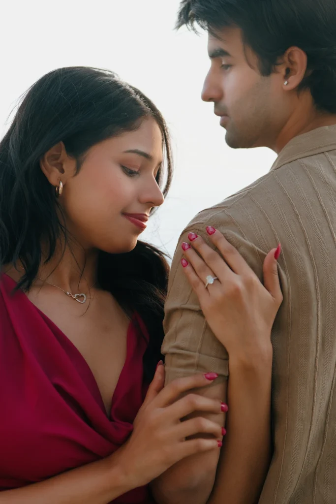Proposal photoshoot capturing the engagement ring and emotional connection between the couple
