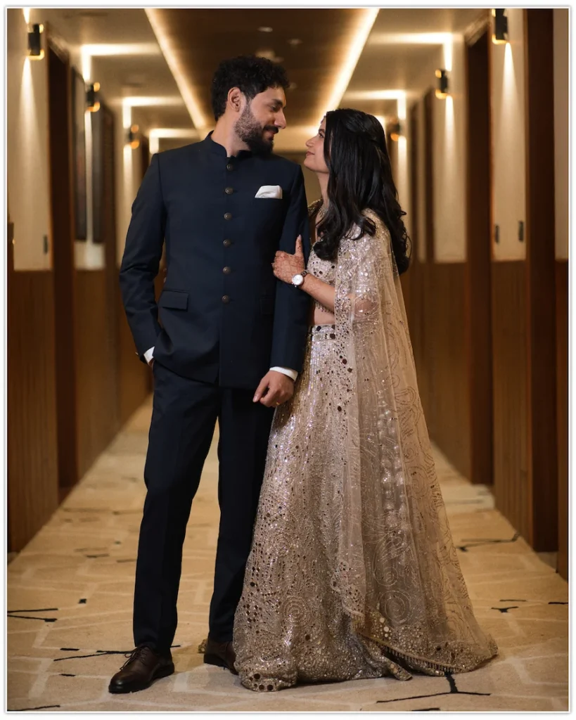 Elegant bride and groom sharing a romantic moment in a beautifully lit wedding venue captured by a Wedding Photographer in Dehradun.