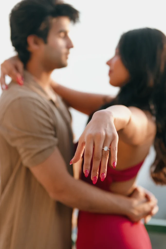 Man proposing to his partner during a beautiful mountain-view proposal session