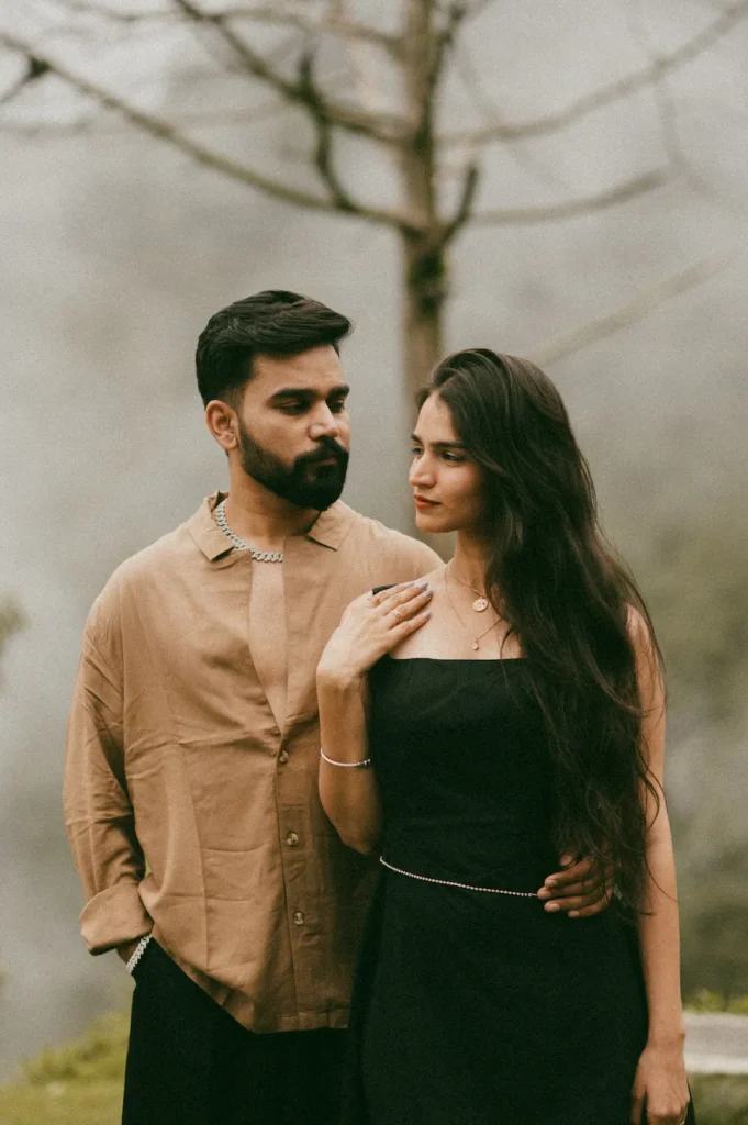 Elegant couple portrait with soft natural light and dreamy forest backdrop