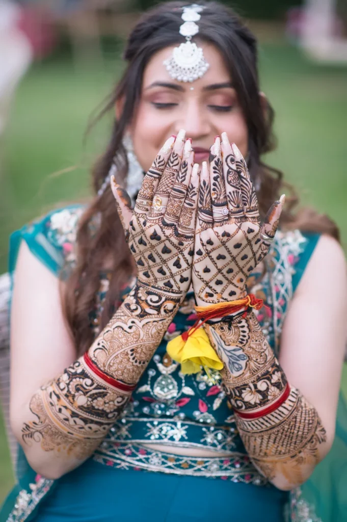 Wedding Photography capturing intricate bridal mehndi with elegant hand details and candid expressions