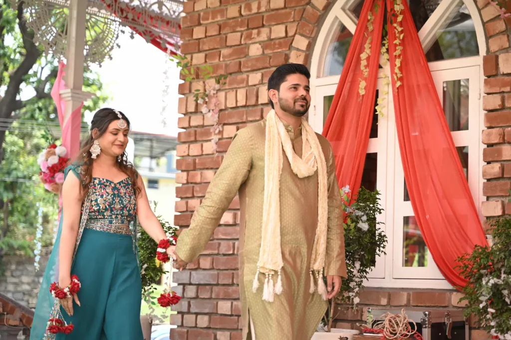 Wedding Photography featuring a couple holding hands during a joyful celebration at a beautifully decorated venue