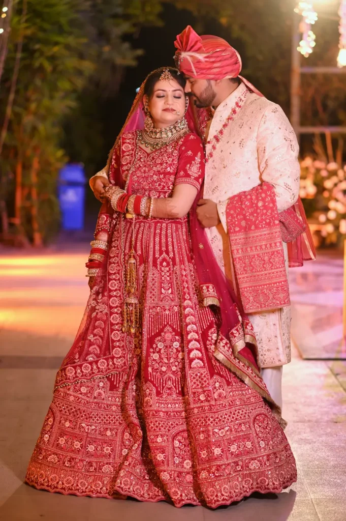 Wedding Photography featuring a bride and groom in traditional attire sharing a beautiful romantic portrait during the wedding celebrationDD