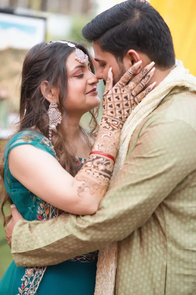 Wedding Photography featuring a close-up couple portrait with intricate mehndi, elegant attire, and heartfelt emotions