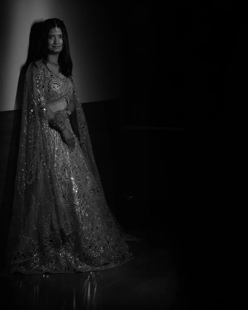Artistic black and white bridal portrait with dramatic lighting and timeless elegance.