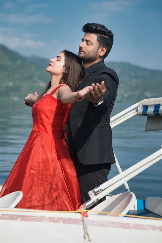 Cinematic Tehri Pre Wedding Shoot capturing a couple enjoying a romantic boat photoshoot on the beautiful waters of Tehri Lake.