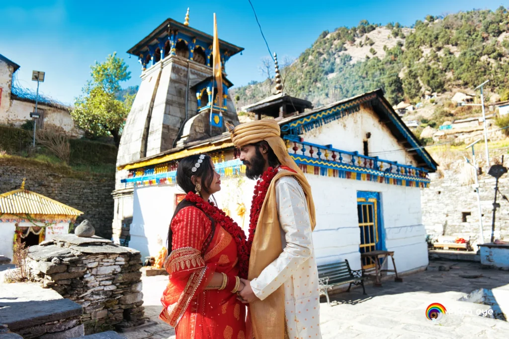 Bride and groom at Triyuginarayan Temple during a traditional destination wedding ceremony
