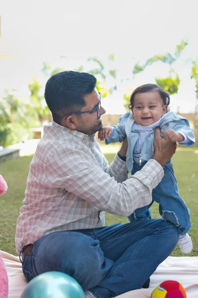 First Birthday father and son moment featuring baby Jiyansh sharing a joyful smile