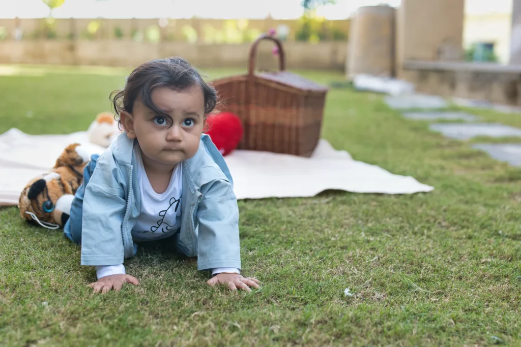 First Birthday milestone session capturing baby Jiyansh exploring the outdoors