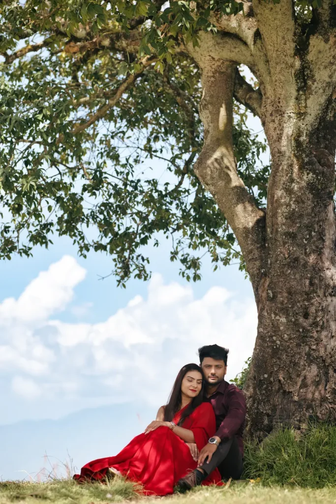 Romantic portrait of a couple sitting together in a quiet natural setting.