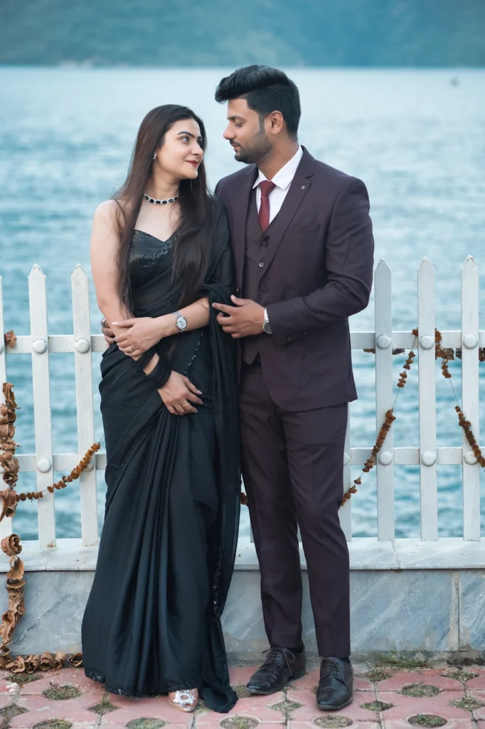 Relaxed portrait of a couple sitting together in a natural outdoor setting.
