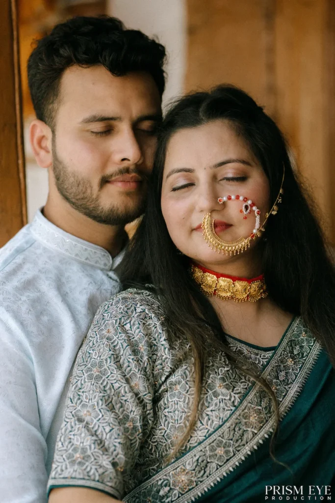 Romantic couple sharing a peaceful embrace in a traditional village home with rustic wooden architecture
