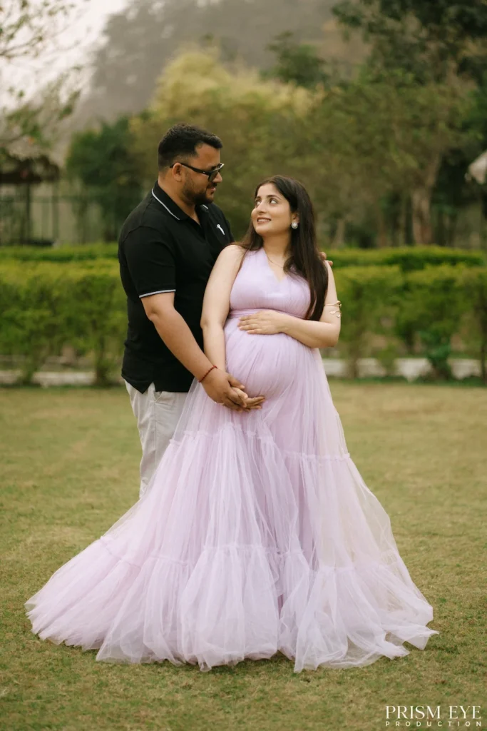 Expecting couple sharing a loving embrace while celebrating the excitement of welcoming their baby.
