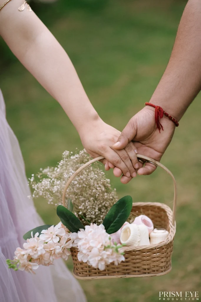 Close-up of an expecting couple holding hands during a heartfelt maternity portrait.