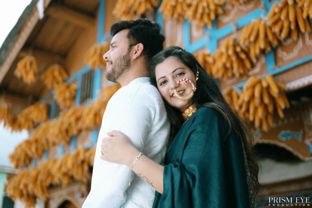 Happy couple embracing in front of a beautifully decorated rural heritage home