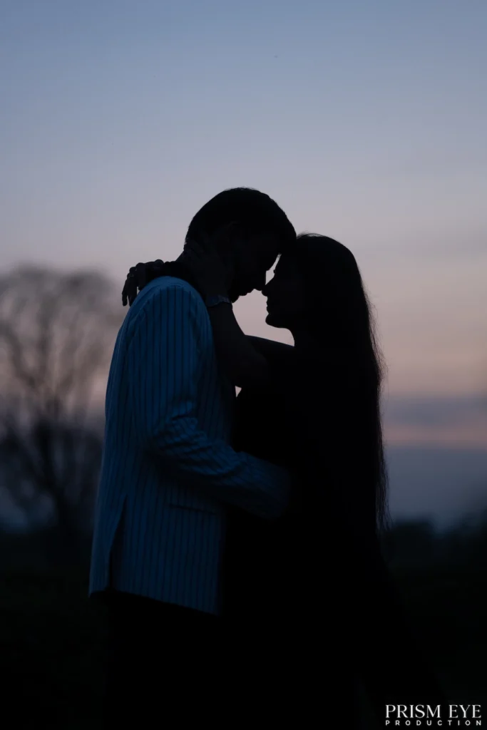 Top Photographers in Rishikesh capturing a romantic silhouette pre-wedding couple portrait at sunset.