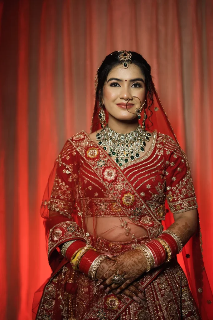 Classic bridal portrait in traditional red wedding attire by Wedding Photographers in Rishikesh
