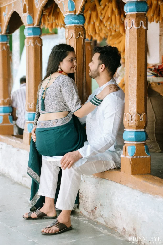 Couple sharing a romantic conversation on the veranda of an authentic heritage village house