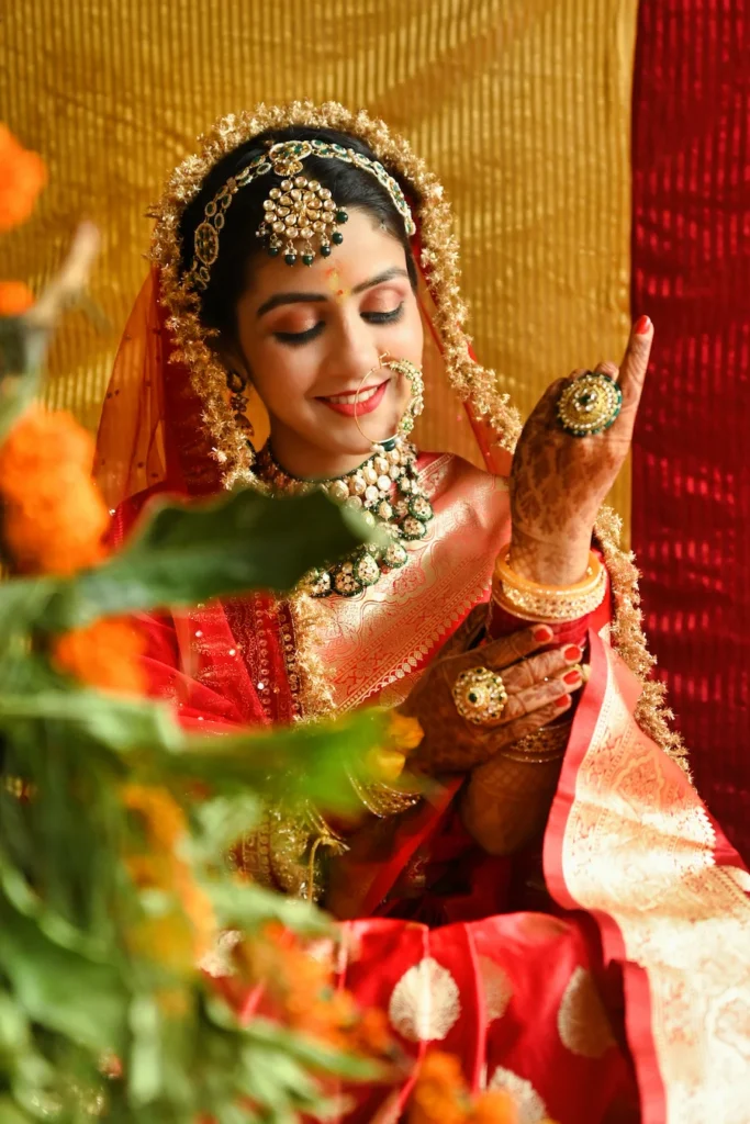 Close-up bridal portrait showcasing elegant traditional jewelry, bridal makeup, and graceful wedding expressions.