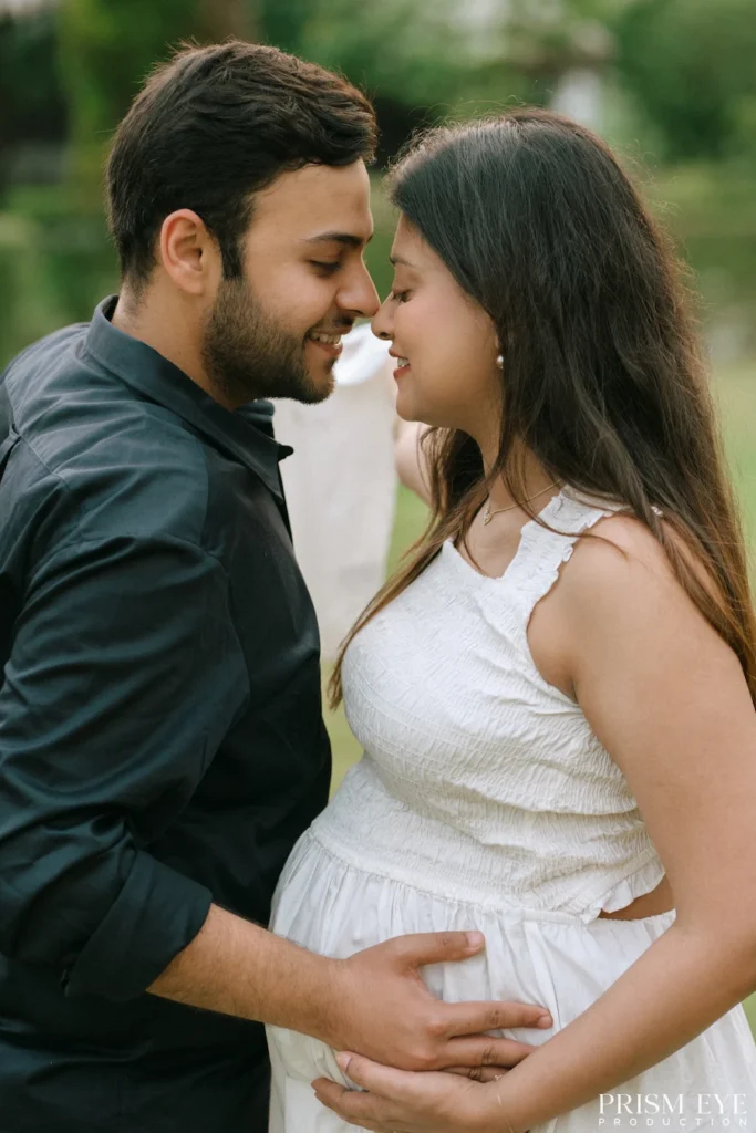 Couple embracing during a Maternity Photoshoot, celebrating pregnancy with a romantic outdoor portrait and natural expressions.
