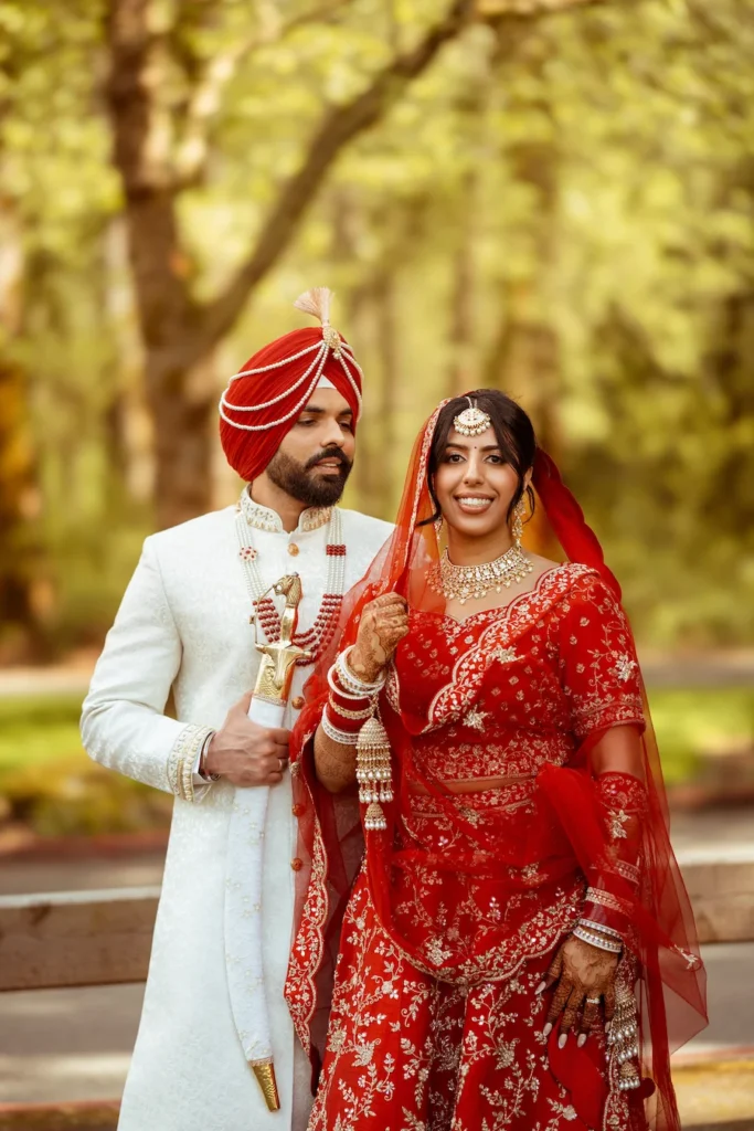 Punjabi wedding in Rishikesh couple portrait in traditional Sikh wedding attire surrounded by natural greenery
