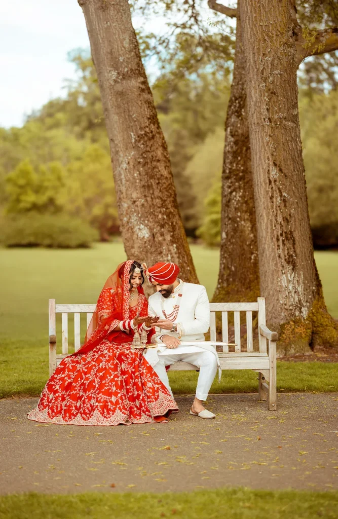 Punjabi wedding in Rishikesh couple portrait holding hands in traditional Sikh wedding attire surrounded by nature