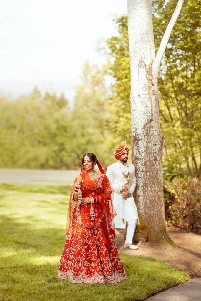 Bride and groom walking together during a Punjabi wedding in Rishikesh captured in a candid wedding moment