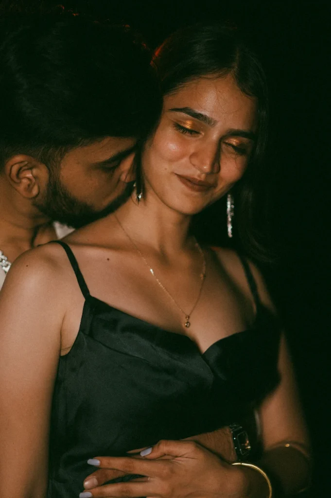 Close-up portrait of a couple sharing an intimate moment with warm cinematic lighting