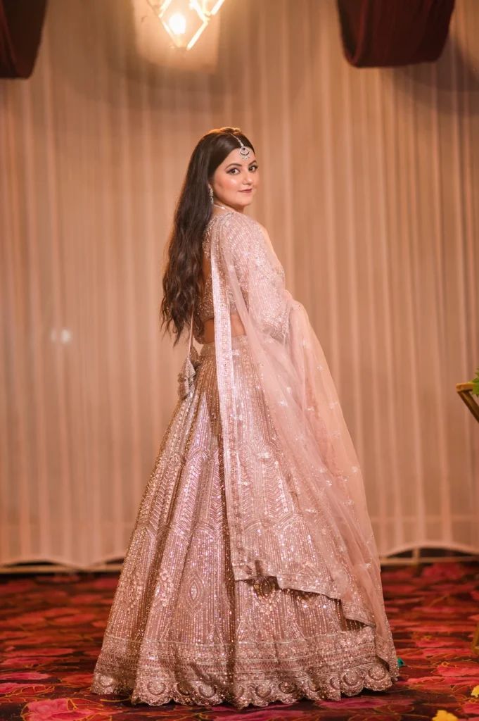 Elegant bridal portrait in a shimmering lehenga during the wedding celebration