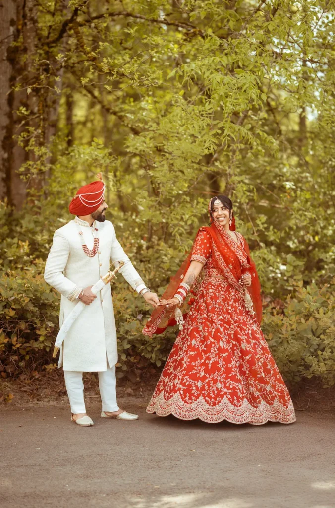 Punjabi bride and groom holding hands during an intimate wedding photoshoot in Rishikesh.