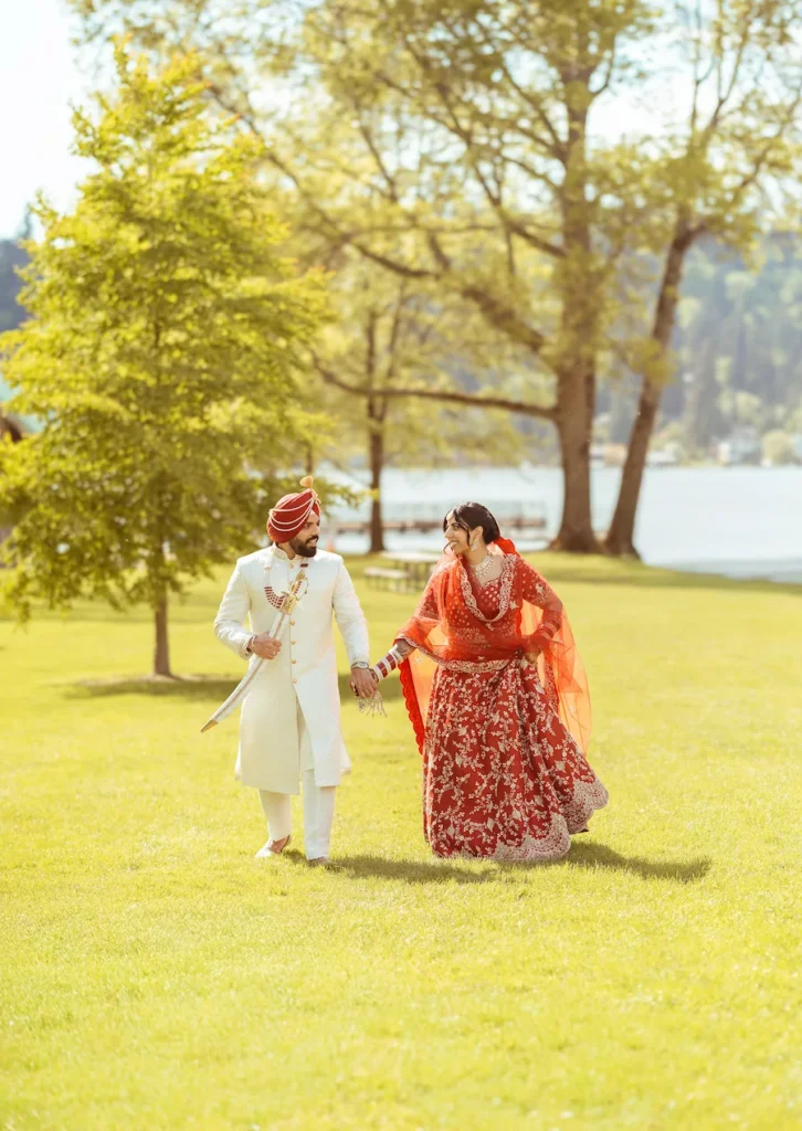 Punjabi wedding in Rishikesh couple enjoying romantic moments on a lush green lawn during their destination wedding