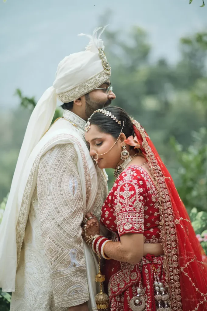 Bride resting on the groom's shoulder in a heartfelt wedding portrait.