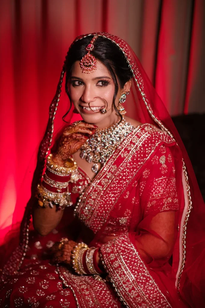 Close-up bridal portrait showcasing intricate jewelry, bridal makeup, and traditional wedding styling