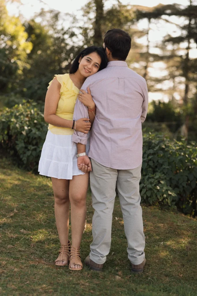 Romantic pre wedding photography in Dehradun showcasing a couple embracing in a natural outdoor location.