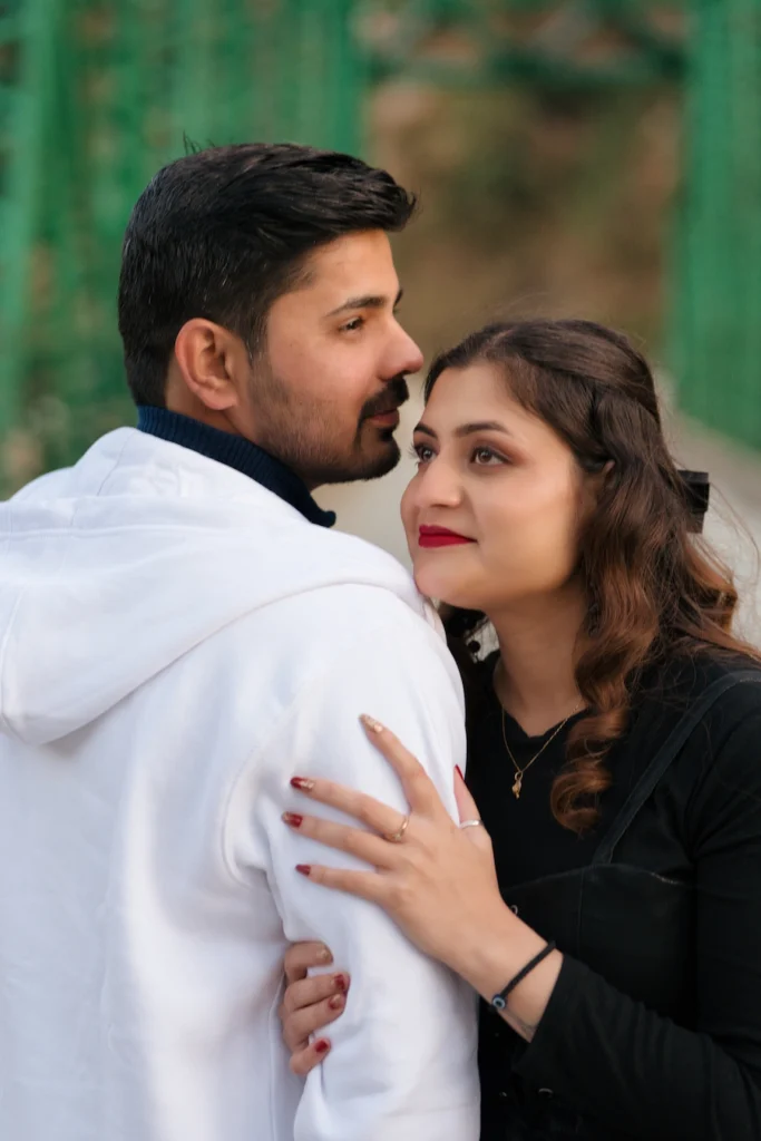 Candid close-up portrait from a pre-wedding shoot on a heritage bridge
