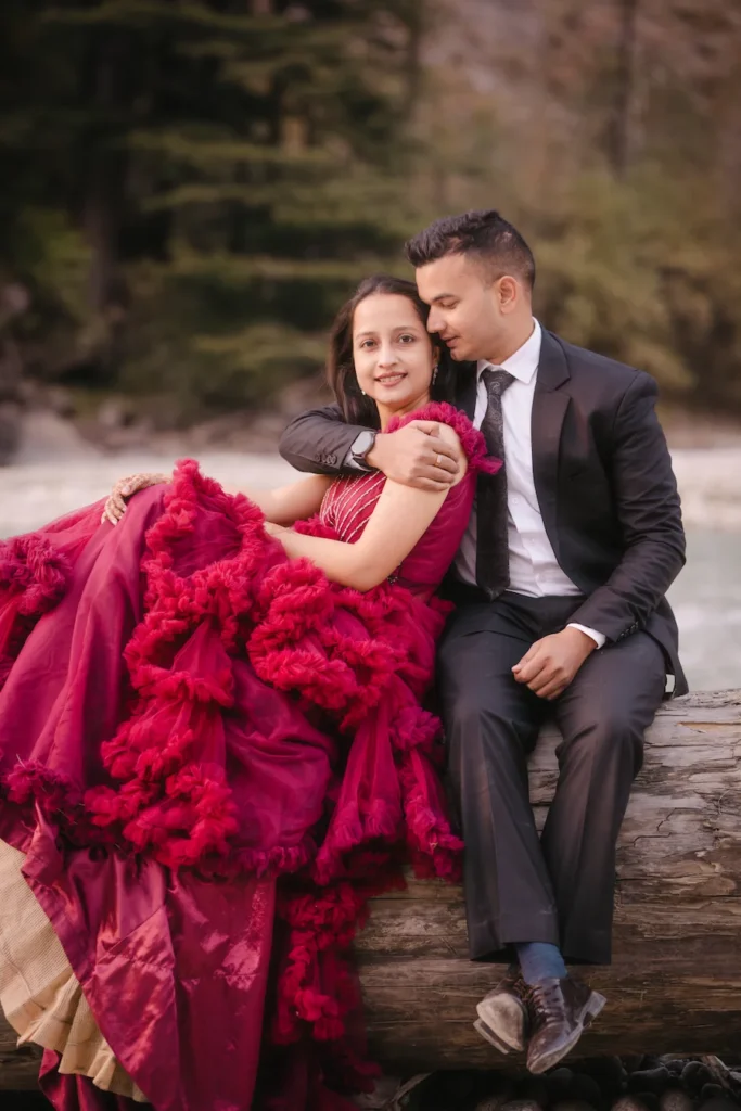 Elegant red gown portrait captured during a forest pre-wedding shoot