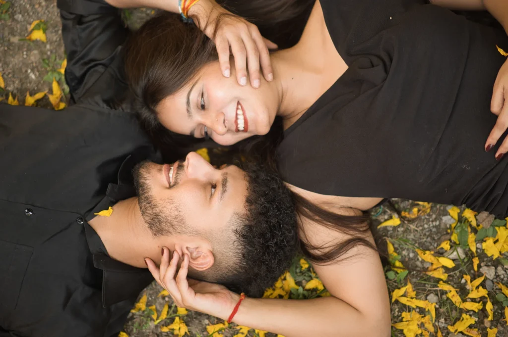 Best Pre Wedding Photographer in Dehradun capturing a romantic couple portrait in a scenic forest setting in Uttarakhand.
