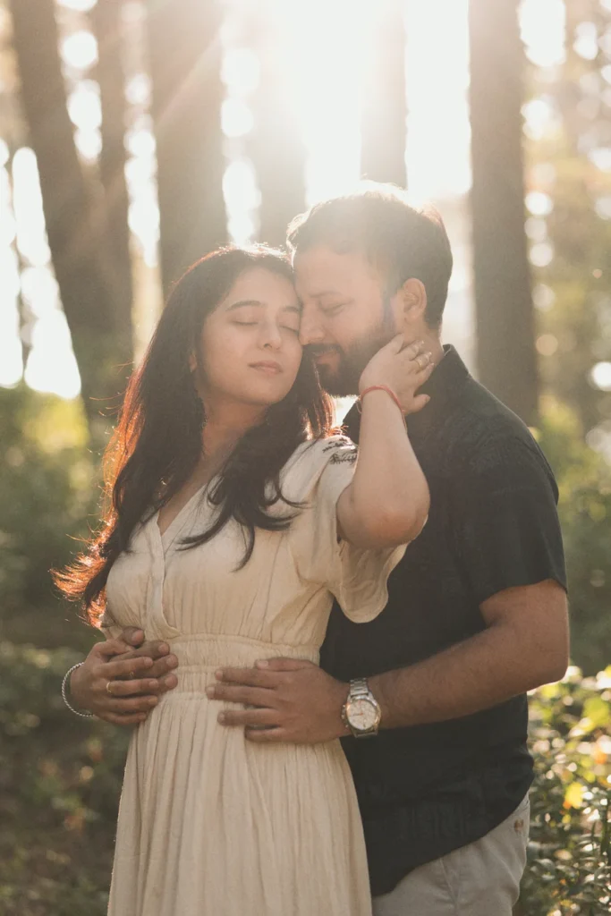 Golden hour pre wedding photography by a Professional Pre Wedding Photographer in Dehradun featuring a couple in a forest setting.