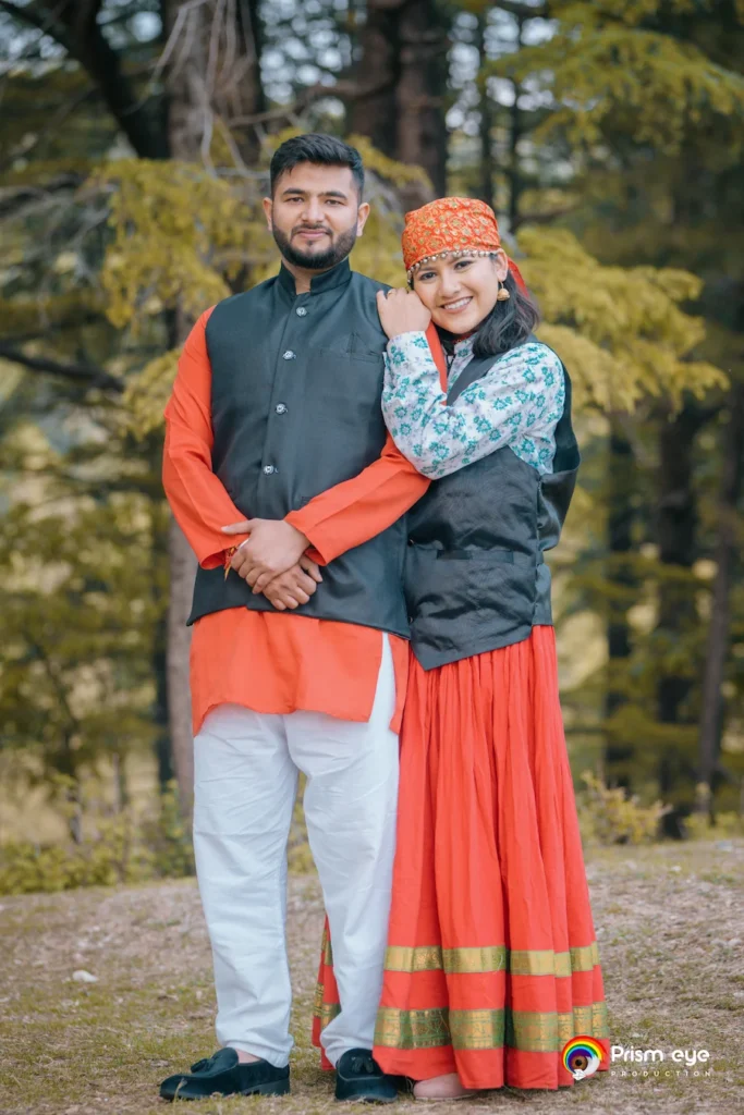 Traditional Pahadi Pre-Wedding couple wearing authentic Garhwali attire in a forest setting near Dehradun