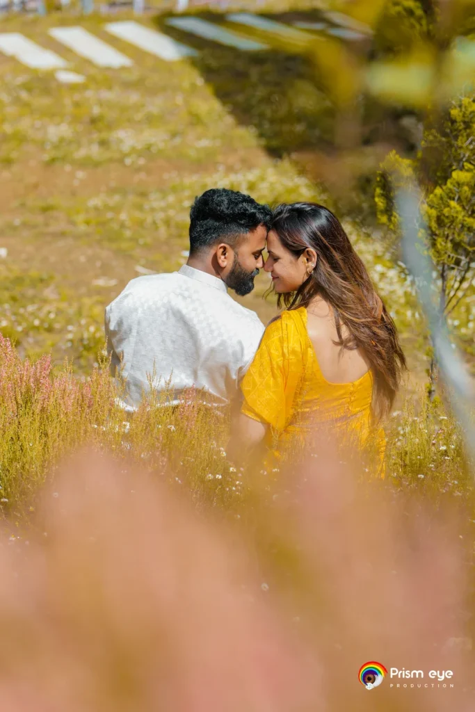 Traditional Pahadi Pre-Wedding couple sharing a romantic moment in a scenic mountain meadow in Uttarakhand