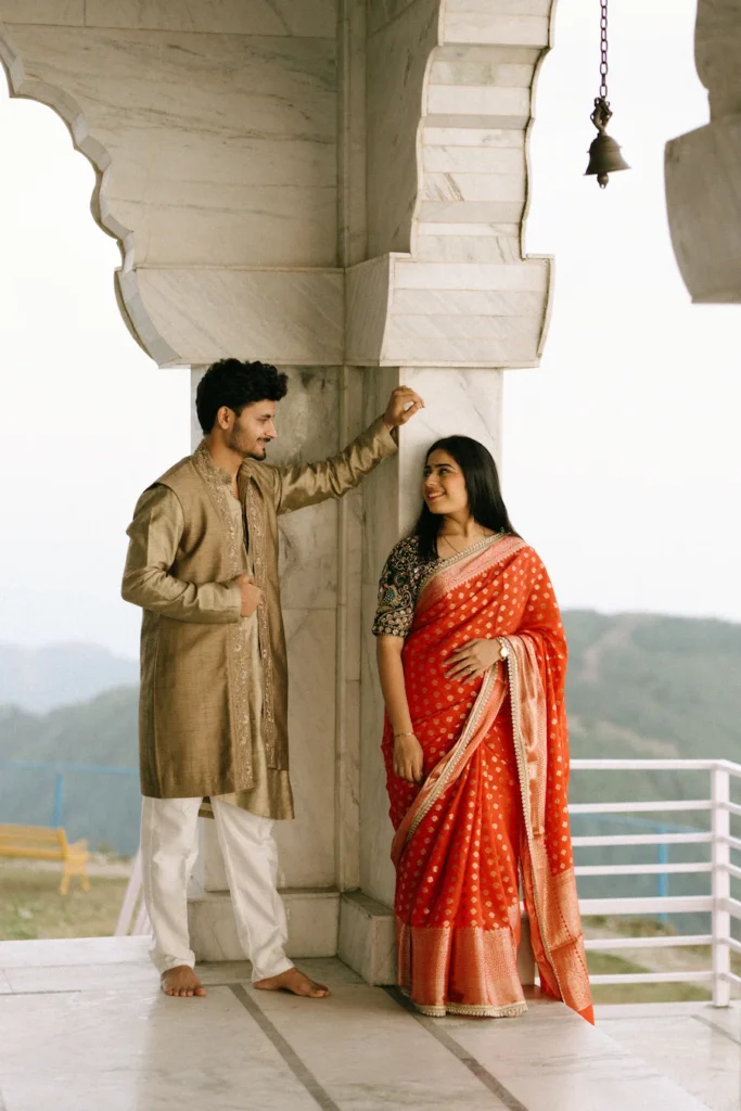 Traditional Pahadi Pre-Wedding photoshoot at a hilltop temple showcasing Uttarakhand culture and traditional outfits