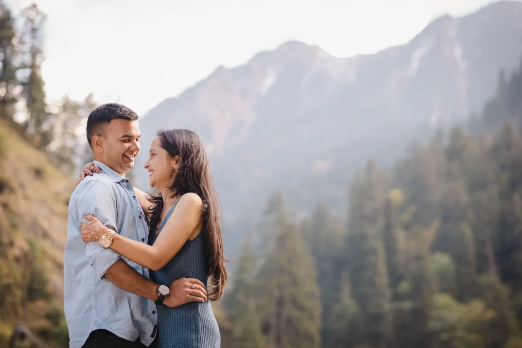 Couple sharing a romantic moment on a heritage bridge in Uttarakhand