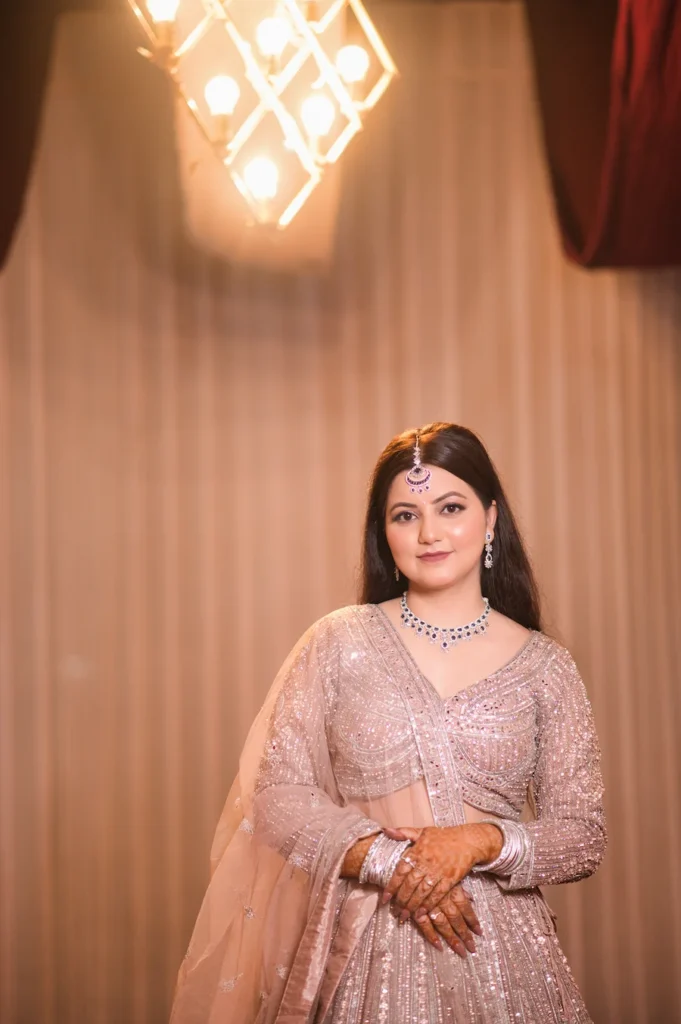Graceful bridal portrait in a pastel embellished lehenga with elegant wedding styling