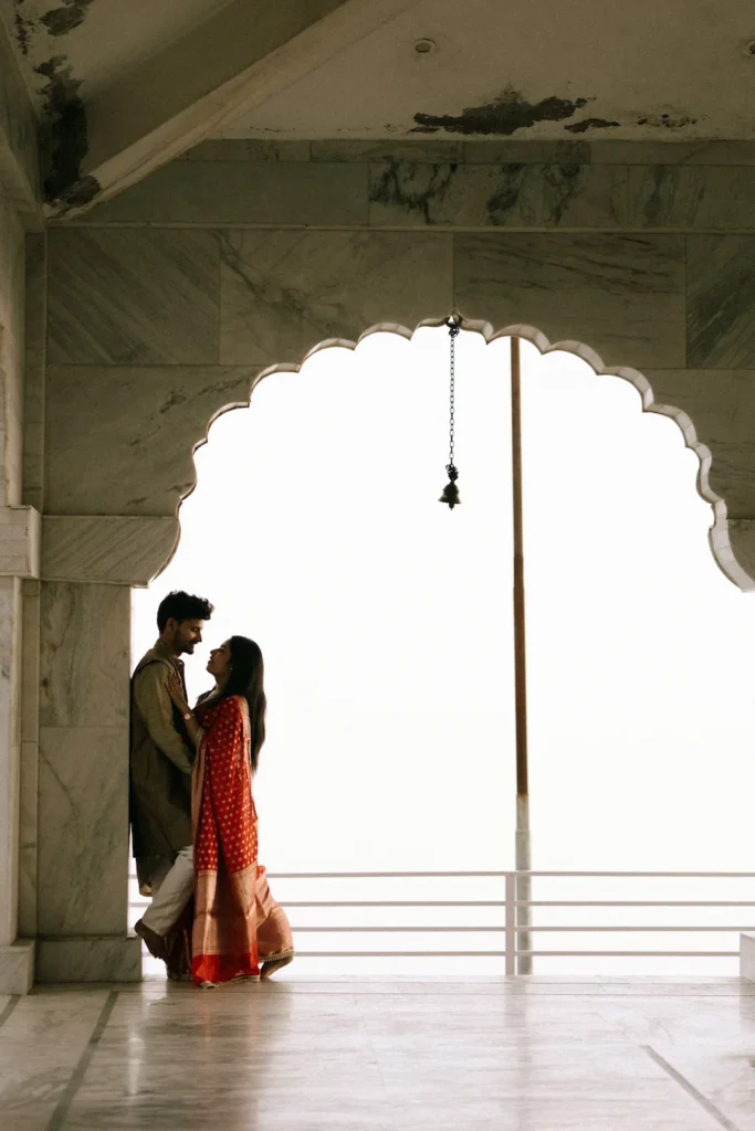 Traditional Pahadi Pre-Wedding couple framed by temple architecture in the hills of Uttarakhand