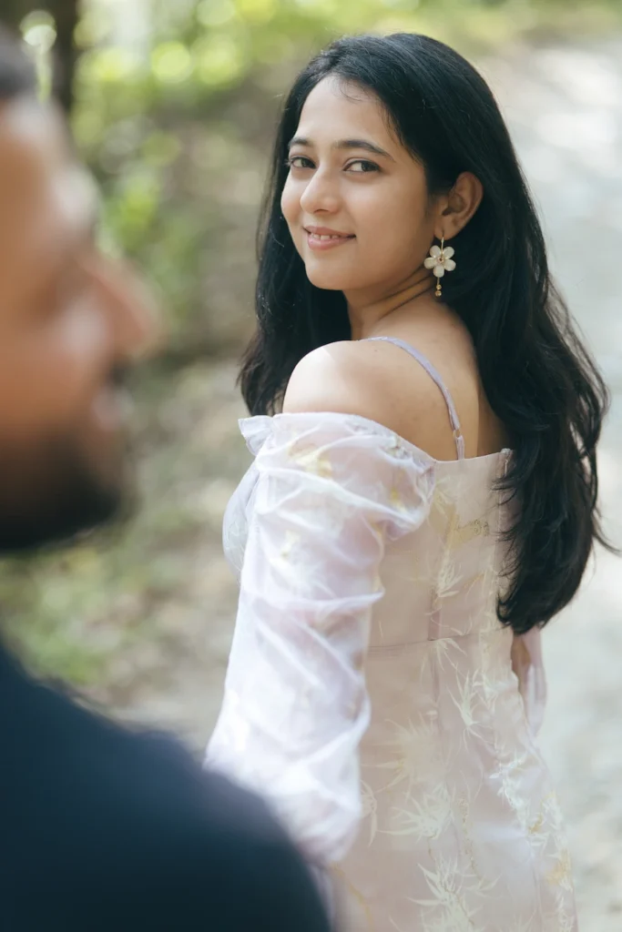 Professional Pre Wedding Photographer in Dehradun capturing a candid bridal portrait during an outdoor couple photoshoot in Uttarakhand.