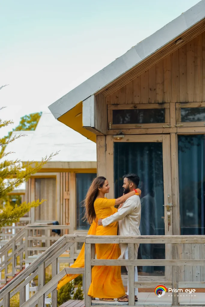 Traditional Pahadi Pre-Wedding couple sharing a romantic moment outside a mountain cottage in Uttarakhand