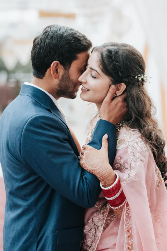 Romantic close-up of the newlywed couple sharing a joyful and intimate moment together.