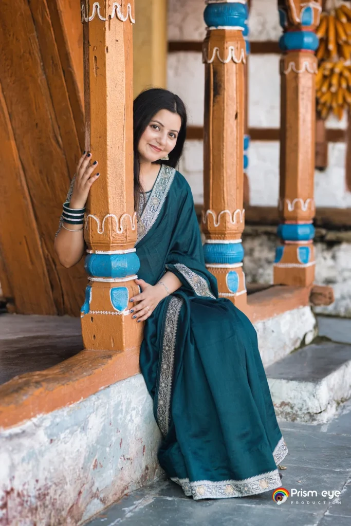 Traditional Pahadi Pre-Wedding bride posing beside traditional Uttarakhand architecture and cultural elements