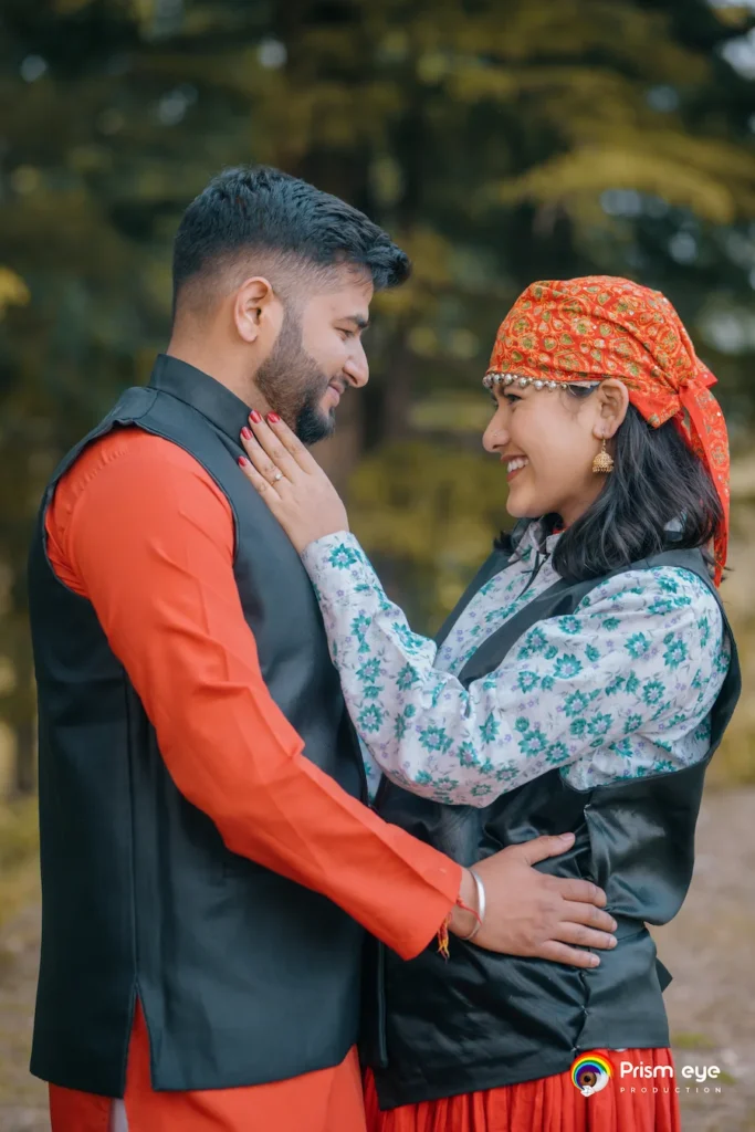 Traditional Pahadi Pre-Wedding couple wearing authentic Garhwali attire in a pine forest setting