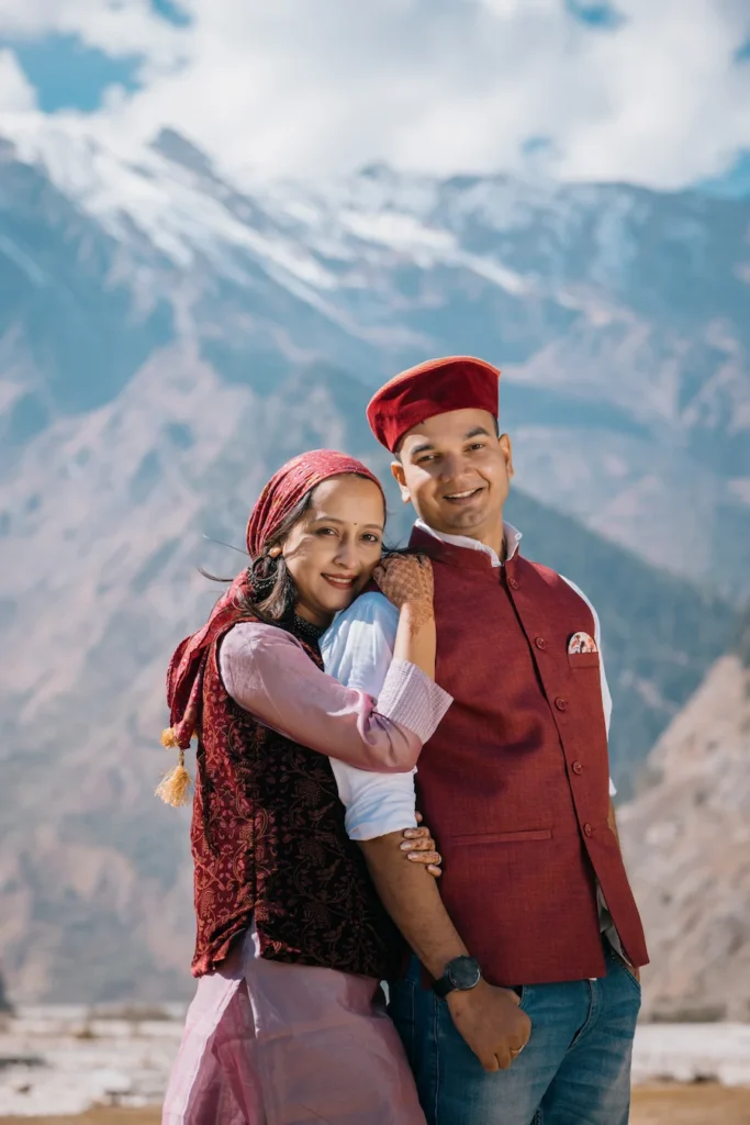 Traditional Uttarakhand couple posing during a pre-wedding shoot in the mountains